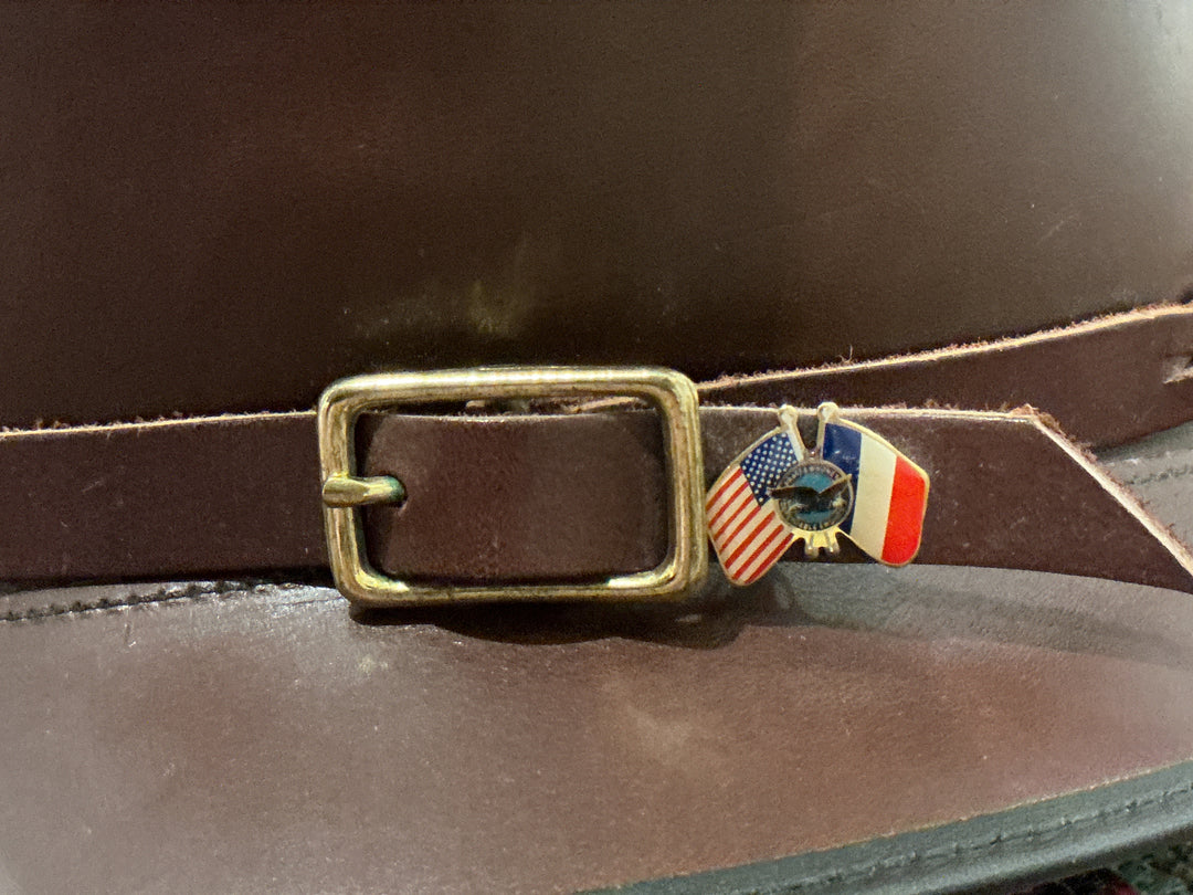 Handmade leather hat with buckle and pin