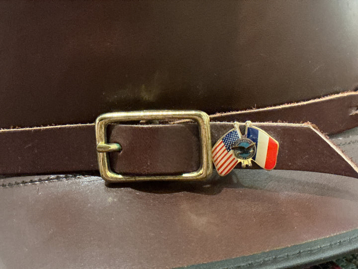 Handmade leather hat with buckle and pin