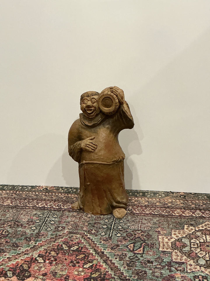 Hand carved drunk monk statue